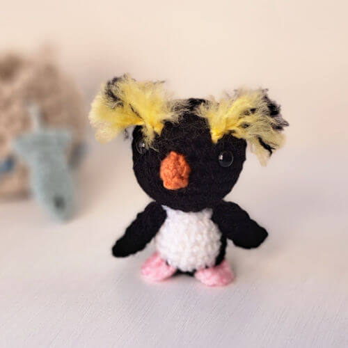 A super cute little rockhopper penguin crochet art figure