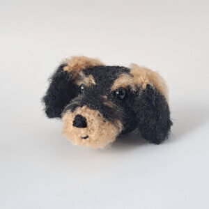 An adorable little long haired wire-haired dachshund brooch